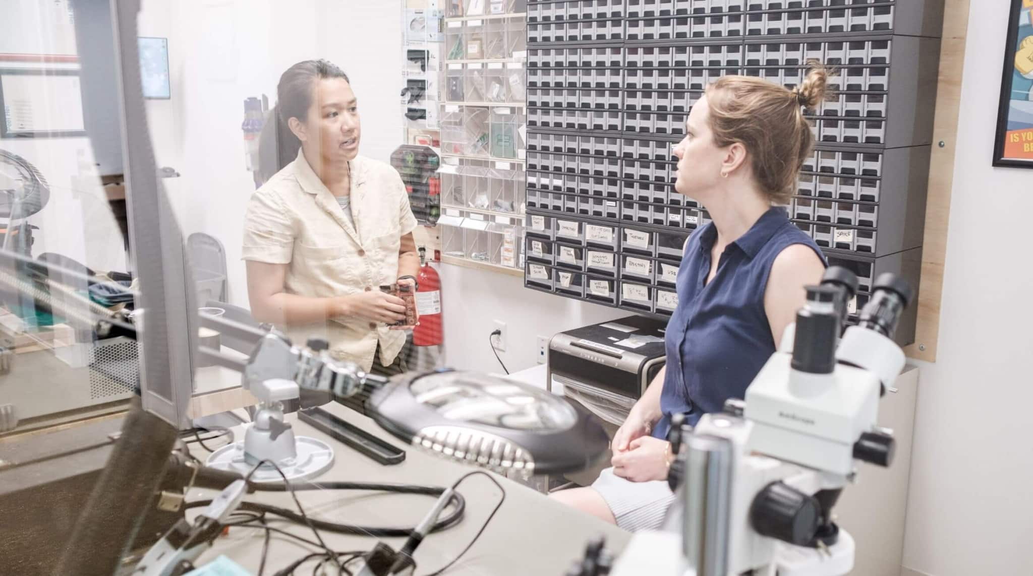 Two People Talking in a Lab